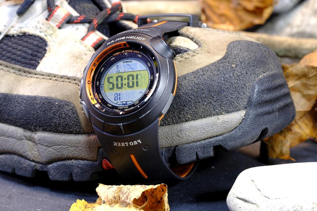Professional timing workspace with modern stopwatch and digital displays